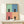 Modern pop art wall print displaying a playful black cat across four panels with a palette of muted sage green, dusty blue, rose, and peachy cream hues.