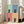 Four-panel minimalist cat print in pop art style with a black cat set against alternating soft sage, slate, dusty rose, and peach colored backgrounds.