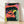 Bold pop art gorilla portrait with vibrant coral, purple, and yellow tones on a black background, framed as a modern wall print.