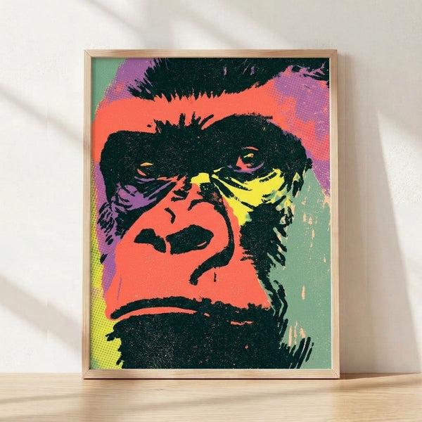 Bold pop art gorilla portrait with vibrant coral, purple, and yellow tones on a black background, framed as a modern wall print.