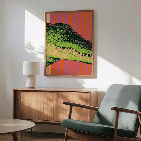 Retro-inspired crocodile wall art featuring bold psychedelic stripes in hot orange, lime green, and purple with black and tan accents, framed contemporary print.