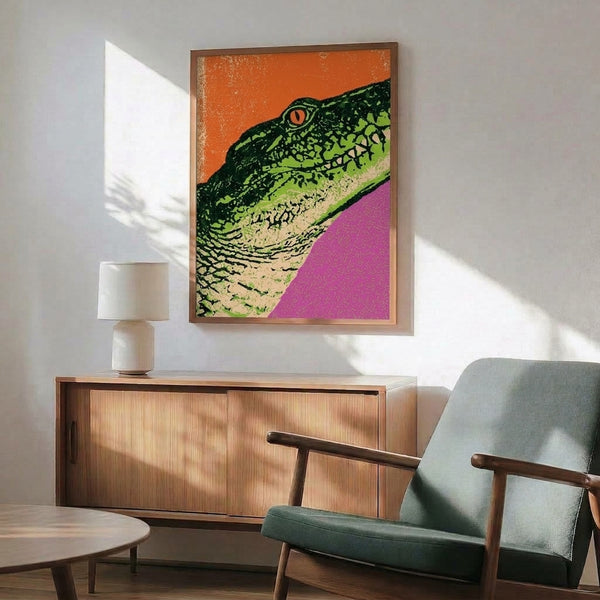 Vibrant modern pop art composition of an iguana in saturated orange, magenta, and lime green colors with bold black outlines, a trendy framed art print for walls.
