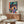 Contemporary pop art wall print of a saxophonist in a stylized architectural setting, dominated by rich turquoise, gold, and purple hues with dynamic energy.