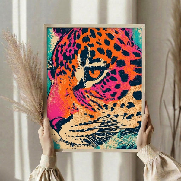 Framed modern leopard portrait with eye-catching turquoise, magenta, and orange pop art aesthetic on cream background.