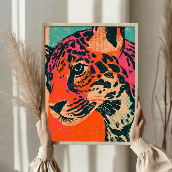 Eye-catching big cat portrait rendered in pop art with striking teal, orange, and hot pink colors, displayed as a modern framed poster with playful energy.
