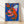 Bold pop art lobster print in royal blue, hot pink, and orange-red with forest green accents, displayed as a framed poster on a wall.