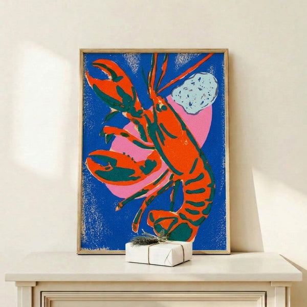 Vibrant abstract lobster artwork in contemporary pop art style featuring cream white, royal blue, and hot pink tones, framed and hanging as modern wall decor.