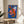 Playful crustacean-inspired pop art print with striking royal blue, orange-red, and hot pink hues on cream background, framed on a wall.