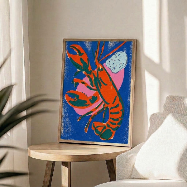 Playful crustacean-inspired pop art print with striking royal blue, orange-red, and hot pink hues on cream background, framed on a wall.