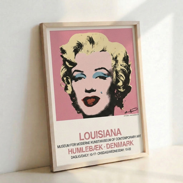 Modern pop art framed print displaying a striking woman's face in bold graphic style with contrasting pink and black, epitomizing iconic 1960s aesthetics.