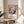 Pop art style portrait print with bold color contrasts in pink, cream, and black, rendered in the distinctive minimalist approach of contemporary visual art.