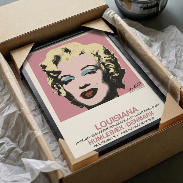 Iconic pop art wall art displaying a stylized female face in vibrant pink and cool blue tones, exemplifying bold 1960s-inspired modern design.