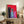 Energetic retro pop art print of three animated cats with exaggerated expressions in vibrant jewel tones on a dark background, perfect for adding humor to modern décor.