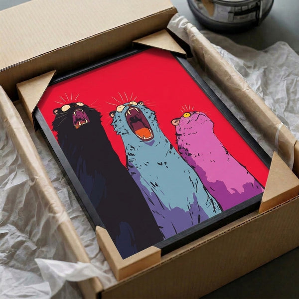 Framed pop art illustration of three colorful cats with wide mouths rendered in bright playful colors against a black backdrop, delivering funky retro visual energy.