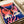 Contemporary pop art owl portrait with oversized eyes in hot pink and orange tones, navy blue background, and cream highlights creating a striking modern aesthetic.