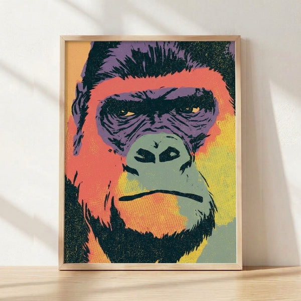 Bold pop art gorilla portrait in vibrant purple, coral red, and teal green with yellow accents, framed poster on wall.