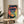 Framed modern pop art print of a gorilla's face in rich jewel tones—purple, teal, and coral red—with bold graphic design.