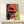 Framed modern pop art print of a gorilla face rendered in striking teal, orange, and black tones with dynamic retro aesthetic appeal.