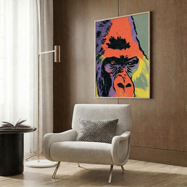 Colorful pop art primate face print with bold orange, teal, and purple sections, displaying expressive retro-modern style as a framed wall artwork.