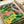 Vibrant pop art wall print showcasing an iguana eye in electric pink and bright green with funky, energetic visual impact.