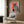 Warhol-inspired zebra head artwork in playful retro colors of orange, pink, and teal, framed and hung as modern wall décor.