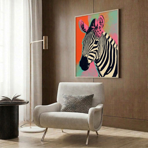 Warhol-inspired zebra head artwork in playful retro colors of orange, pink, and teal, framed and hung as modern wall décor.