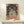 Abstract portrait painting with featureless face rendered in muted earth tones and cream, modern art print on wall.