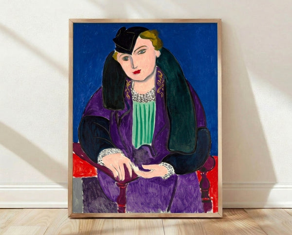 Minimalist portrait of a figure in a vibrant blue coat against a soft neutral background, framed modern art print in Matisse style.