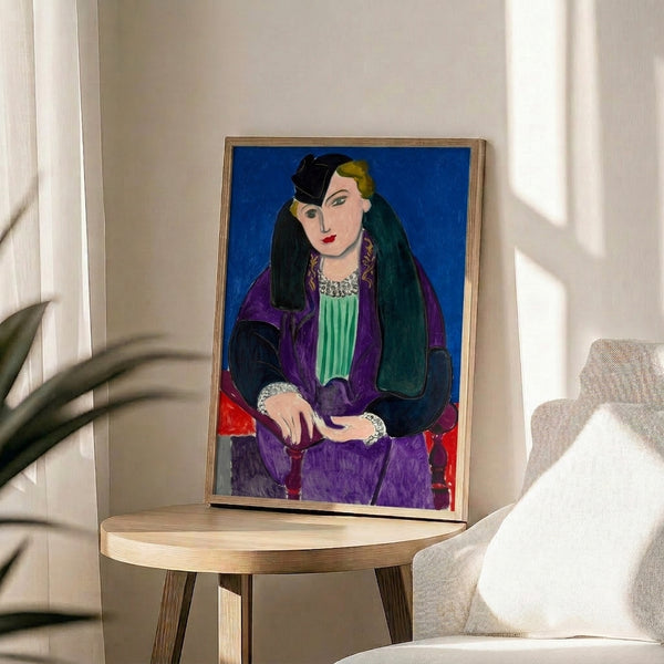 Matisse-inspired framed print of a serene blue-coated figure with minimal facial details, sophisticated modern home decor.