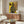 Abstract surrealist portrait with dreamlike quality, geometric shapes, and striking color palette of black, blue, red, and yellow on wall-mounted print.