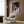 Modern art poster featuring an abstracted human figure in shadowy grays and blacks, executed in an expressive style that emphasizes emotion over realistic detail.