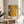 Modern wall art depicting a psychologically intense faceless portrait rendered in burnt sienna, grey, and ochre with expressive, fragmented brushwork.