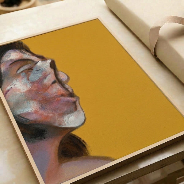 Contemporary abstract portrait artwork showing a distorted, faceless figure in muted browns and blacks with dramatic brushwork, displayed as a framed poster in an interior setting.