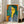 Framed Matisse-style portrait of a contemplative woman's face rendered through bold color fields and simplified forms in ochre, blue, and neutral tones.