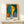 Bold abstract woman's face composed of geometric and organic shapes in saturated yellow, blue, and green hues, embodying modern artistic expression.