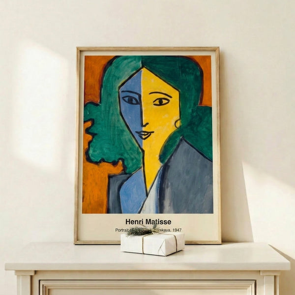 Bold abstract woman's face composed of geometric and organic shapes in saturated yellow, blue, and green hues, embodying modern artistic expression.