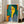 Contemporary art print showing an enigmatic portrait with loose brushwork in yellow, blue, and green, creating a serene and sophisticated wall display.