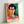 Expressive faceless portrait of a woman in modern style using loose brushwork and a striking palette of green, blue, and warm earth tones.