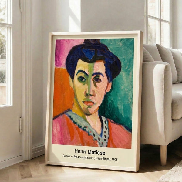 Contemporary framed poster art showing a minimalist woman's portrait with bold color blocking in red, green, blue, and white.
