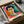Framed modernist portrait artwork featuring a female subject rendered with expressive watercolor technique in vibrant complementary colors.