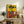 Framed abstract portrait with minimalist composition in earthy tones, blending surreal and cubist elements.