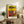 Modern surreal portrait with playfully abstracted features in striking reds, blues, yellows, and warm neutral tones.