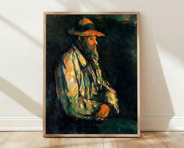 Cezanne portrait painting of Vallier in muted earth tones and soft blues, framed on wall as modern art print with contemplative mood.