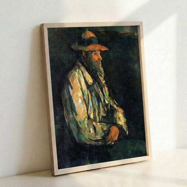 Framed art print displaying a dignified portrait in Cezanne's distinctive style, using layered brushwork and a restrained color palette of browns and blues.