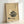 Japandi wall art showing a traditional pot and ladle in delicate minimalist linework, printed in cream, tan, and charcoal gray with nostalgic charm.