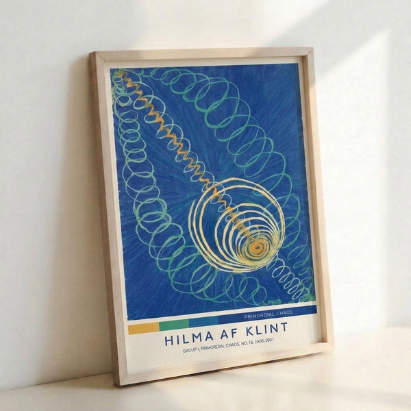 Framed abstract print showcasing nested circles and spiraling geometric patterns in muted blues, greens, and warm golden tones, conveying meditative and ethereal mood.