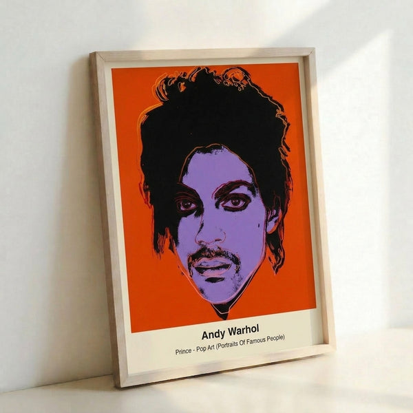 Pop art portrait of Prince rendered in striking magenta and electric blue with bold graphic elements, shown framed as contemporary wall art.