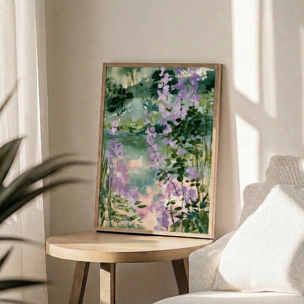 Peaceful garden watercolor art print depicting cascading wisteria blooms in lavender and sage green hues overlooking a tranquil lakeside setting, framed on wall.