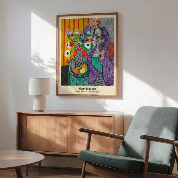 Framed decorative artwork featuring an abstract female figure in flowing purple adorned with blooming anemones rendered in striking magenta, teal, and cream hues.