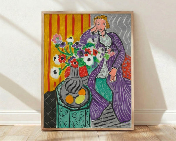Abstract Matisse-style framed poster featuring a figure in a purple robe surrounded by vibrant anemone flowers in bold, expressive colors on a wall.